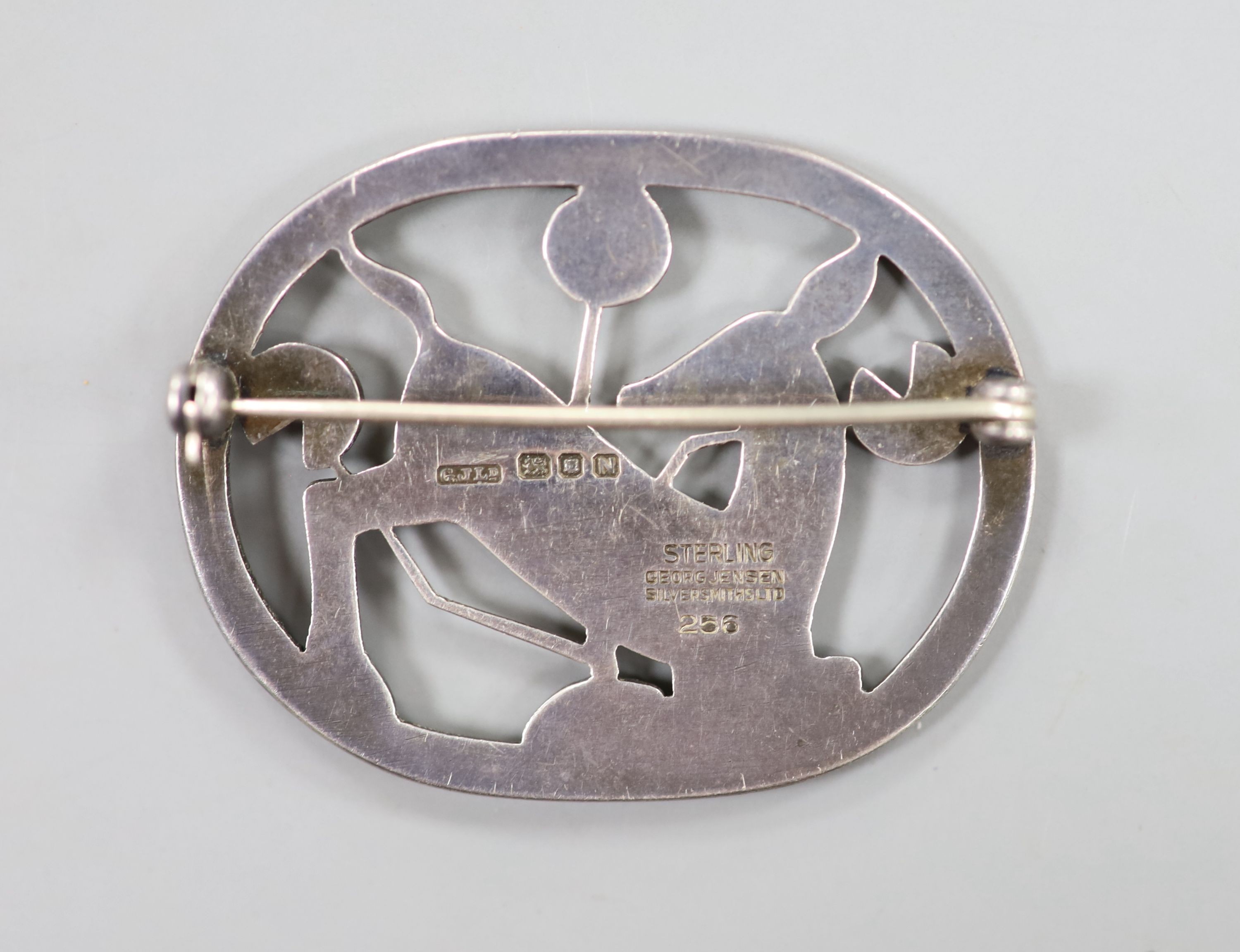 A Georg Jensen sterling kneeling deer oval brooch, no. 256, import marks for London, 1948, 44mm.